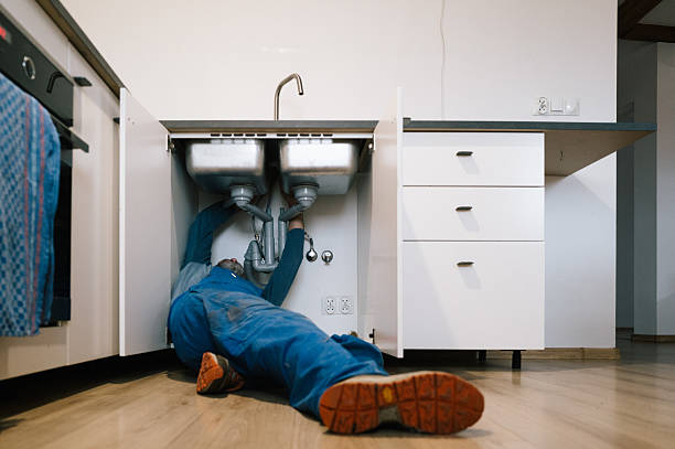 Professional Emergency Plumber technician working in Bondville, IL